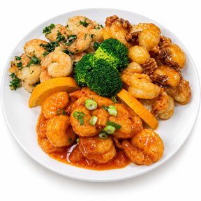 Tri-Color Shrimp: three preparations of shrimp on one plate with broccoli and orange slices.