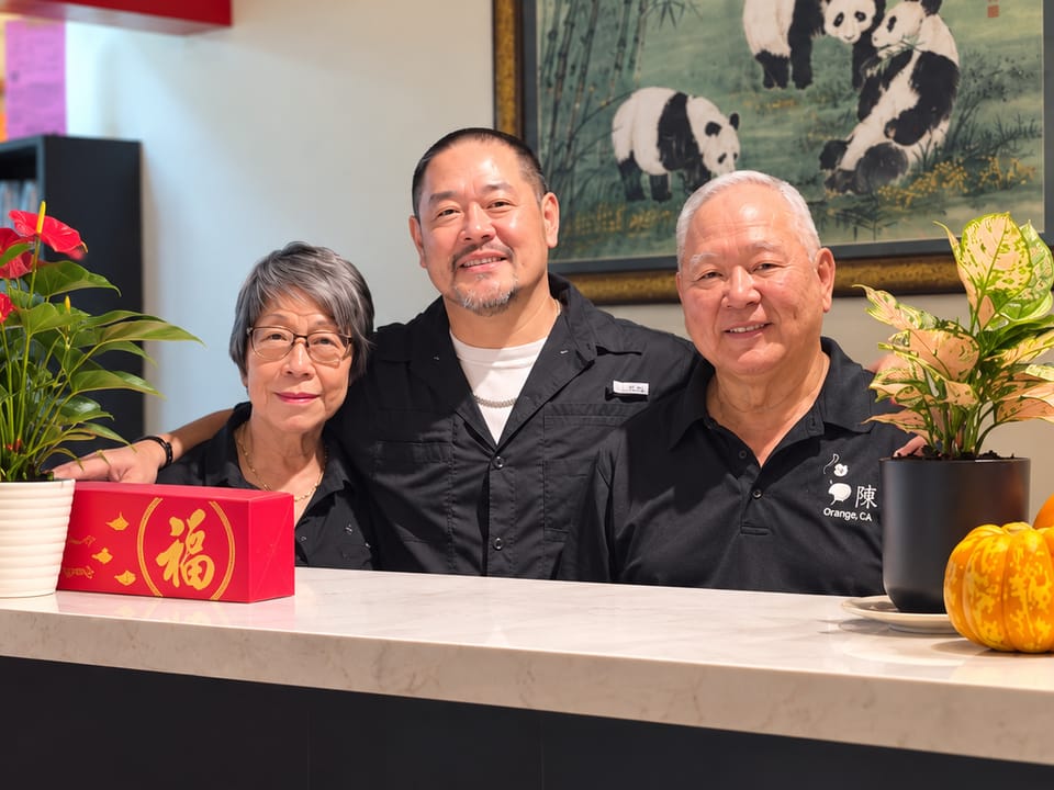 Daniel Chen with his parents behind the front counter at Chen's Chinese Kitchen